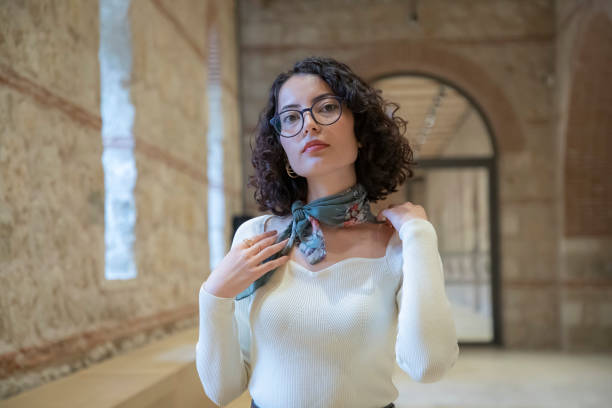 Young beautiful brunette woman in the library
