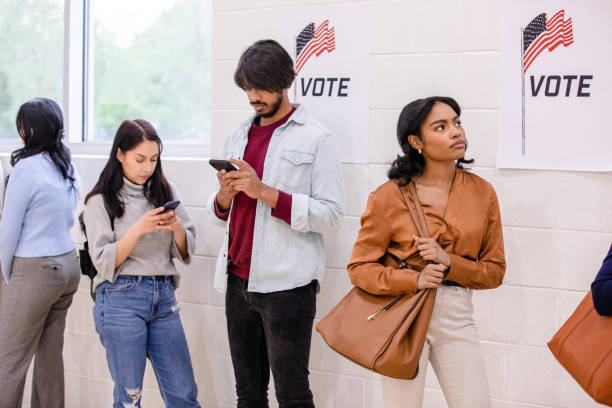 istock Multiracial group of young adults wait in polling line 1500680788