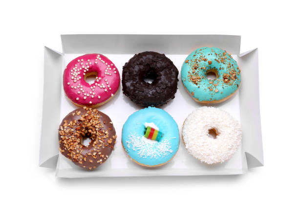 istock Box with tasty glazed donuts isolated on white, top view 1500681041