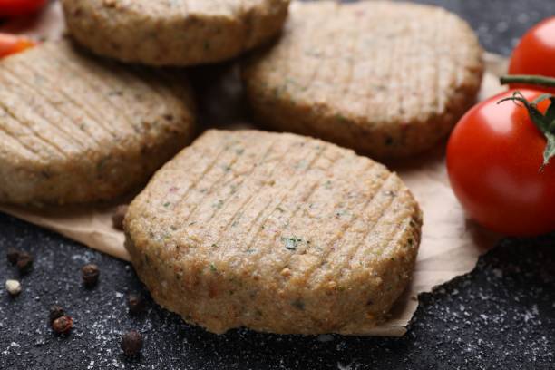 istock Tasty vegan cutlets and products on grey table, closeup 1500681102