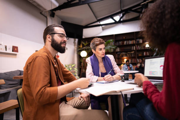 istock Coworkers in a meeting in a cafe 1500682633