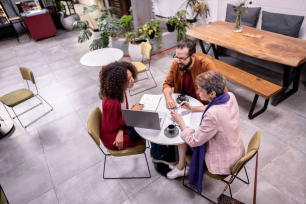 istock Coworkers in a meeting in a cafe 1500682701