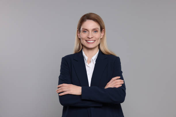 istock Happy real estate agent on grey background 1500686359