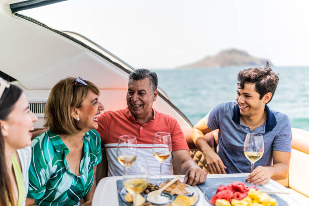istock Family drinking wine and talking during a yacht trip 1500687651
