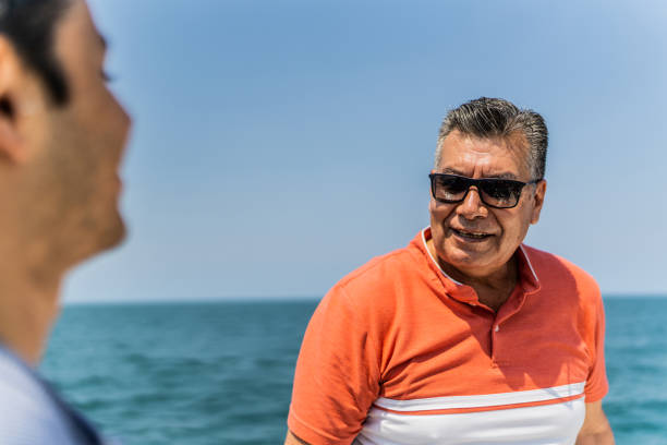 Two men are fishing with a hook