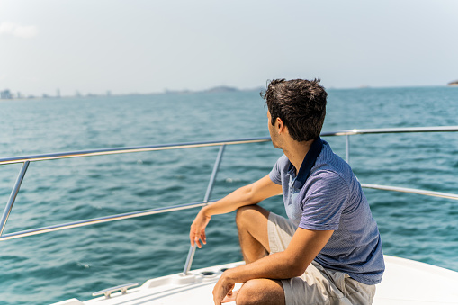Young man contemplating during a yacht trip