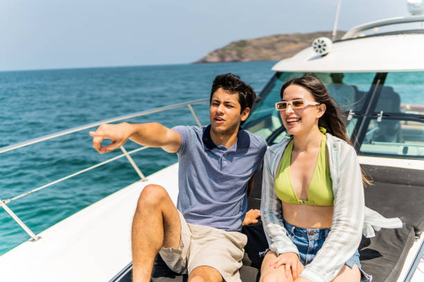 istock Young couple or siblings talking during a yacht trip 1500687839
