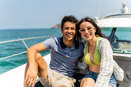 Portrait of young couple or siblings during a yacht trip