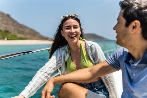istock Young couple or siblings talking during a yacht trip 1500688028