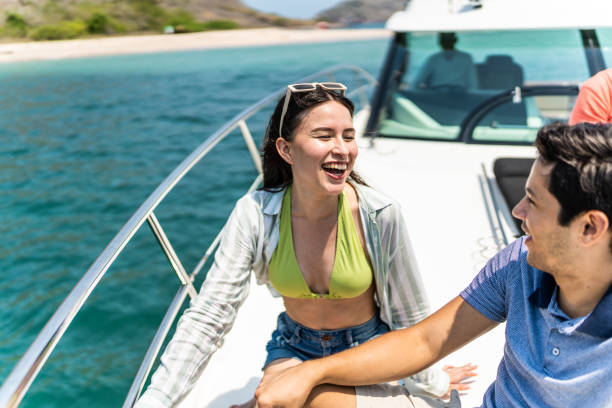 istock Young couple or siblings talking during a yacht trip 1500688037