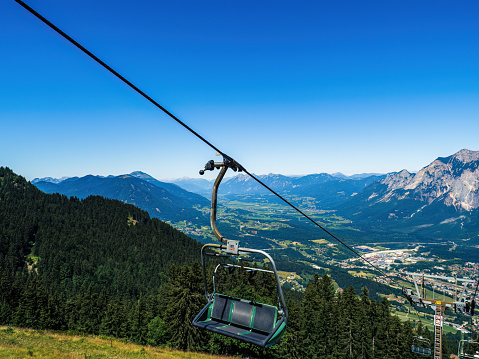 Chairlift ski lift chair going upwards empty in Austria, Carinthia, during summer