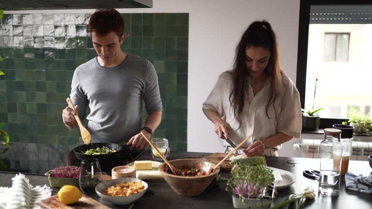 Couple cooking together at kitchen