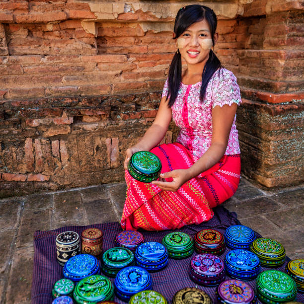 istock Young Burmese girl selling a lacquerware in Bagan, Myanmar 1500695550