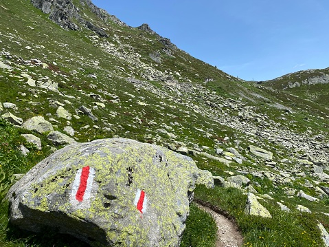 Hiking trails or mountaineering routes in the summer Swiss Alpine environment and in the St. Gotthard pass (Gotthardpass) mountain area, Airolo - Canton of Ticino (Tessin), Switzerland (Schweiz)