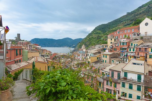 Vernazza Italy - April 25 2011; Church on hill and rooftops in high density housing in hillsiide historic Italian fishing villlage