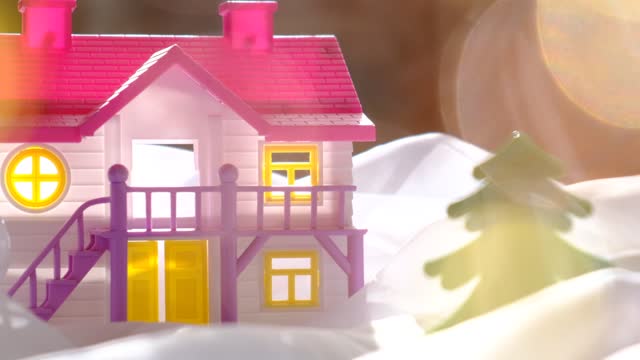 Winter and Christmas concept. Dollhouse and fairy magic cozy atmosphere, golden bokeh