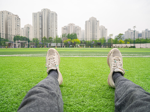 Soccer player sitting on turf