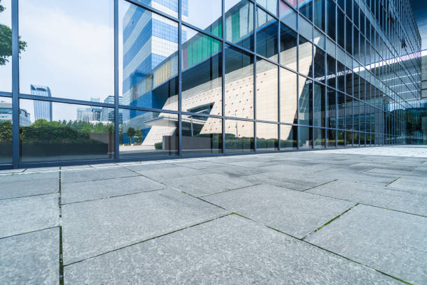 istock buildings and clean road reflected on the glass wall 1500725337