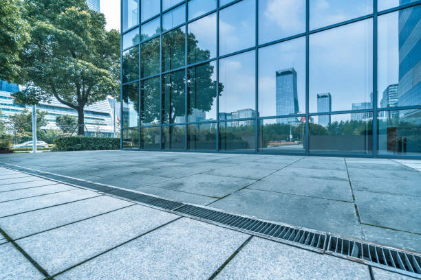 istock buildings and clean road reflected on the glass wall 1500725338