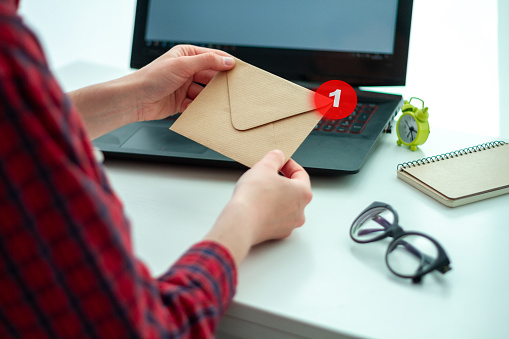 Craft paper envelope with a letter. Written correspondence. Receive and send messages. Message concept