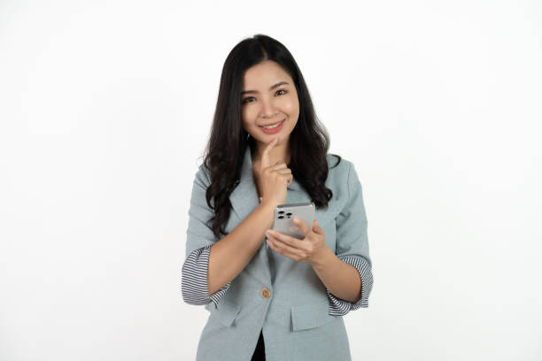 istock Surprise asian beautiful woman using smartphone isolated on white background. 1500728529