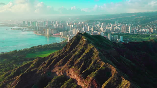 Aerial view of Diamond Head Crater with Honolulu skyline in the background. Oahu island, Hawaii. United States.