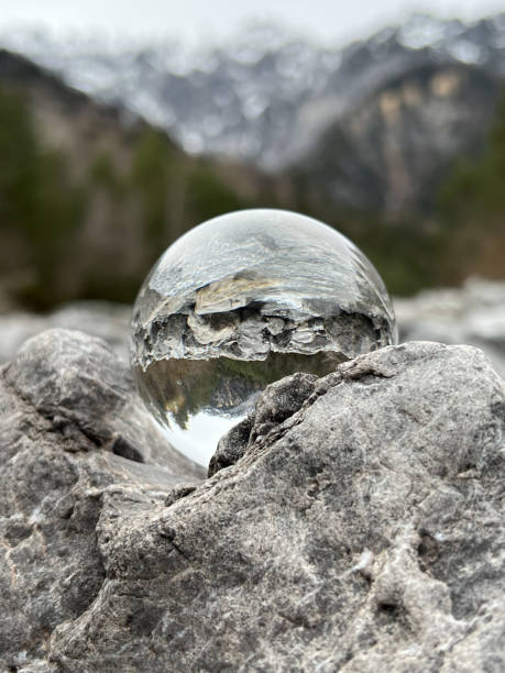 Lensball, reflecting an alpine creek. stock photo