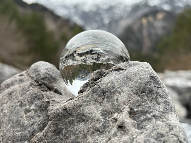 Lensball, reflecting an alpine creek. stock photo