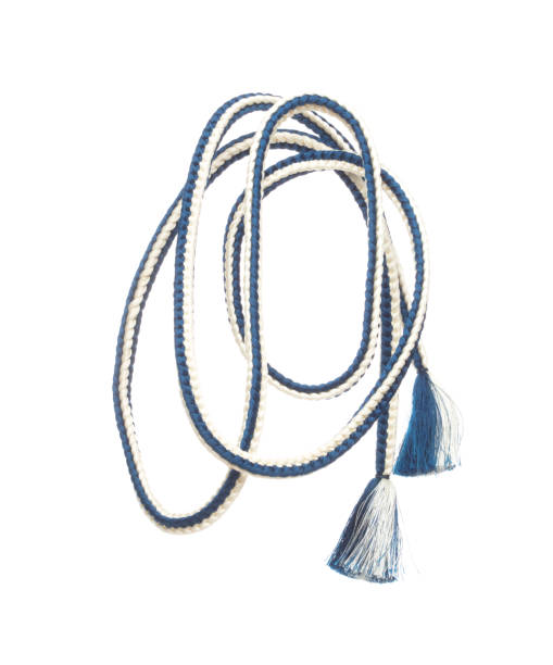 istock String rope obi Japanese Traditional Komono equipment fly in air with curve. String rope obi Japanese Traditional Komono fabric is beautiful clothes for ceremony event. White background isolated 1500743396