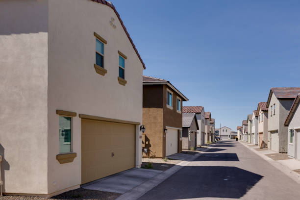 istock Back of a model home with two-car garage. 1500744685