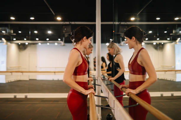 istock group of women exercising on the barre class 1500746617