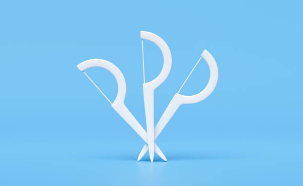 istock 3d toothpick dental floss isolated on blue background. 3d render illustration, clipping path 1500751233