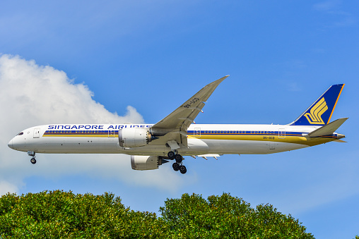 Singapore - Mar 27, 2019. 9V-SCD Singapore Airlines Boeing 787-10 Dreamliner landing at Changi Airport (SIN). Changi serves more than 100 airlines flying to 400 cities.