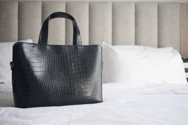 istock women purse wallet on bed, close up. 1500763150