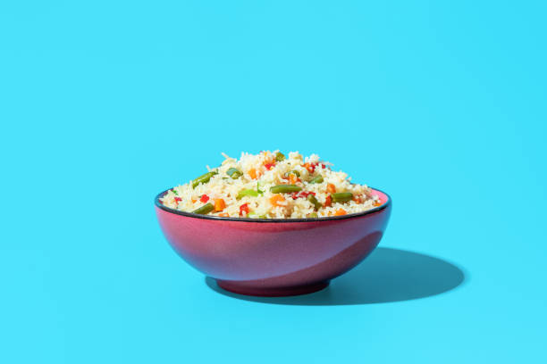 istock Fried rice with vegetables, an asian dish, on a blue background 1500763900