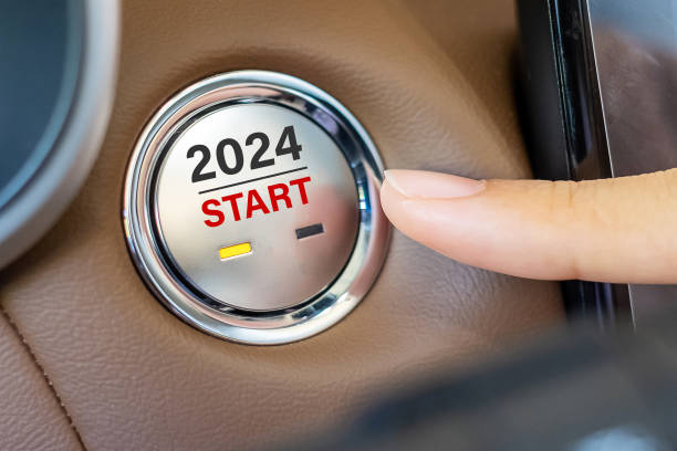 istock Finger press a car ignition button with 2024 START text inside  automobile. New Year New You, forecast, resolution, motivation, change, goal, vision, innovation and planning concept 1500766046