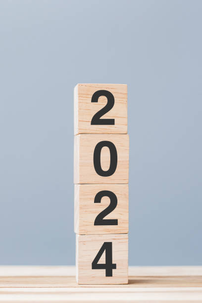 istock wooden cube block with 2024 text on table background. Resolution, plan, review, goal, start and New Year holiday concepts 1500766105