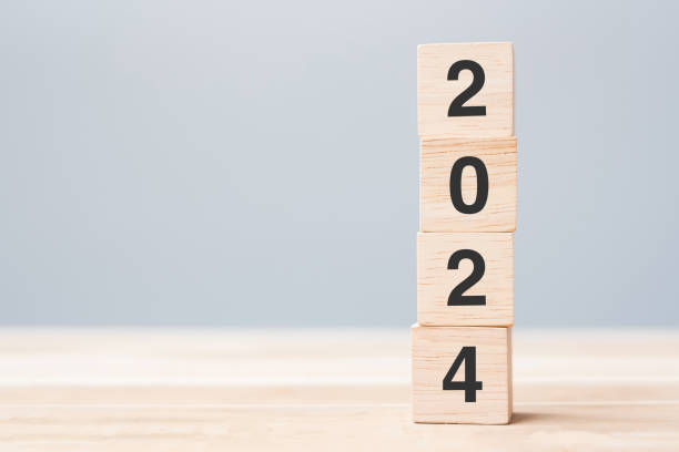 istock wooden cube block with 2024 text on table background. Resolution, plan, review, goal, start and New Year holiday concepts 1500766110