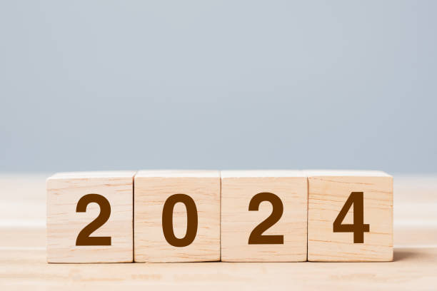 istock wooden cube block with 2024 text on table background. Resolution, plan, review, goal, start and New Year holiday concepts 1500766128