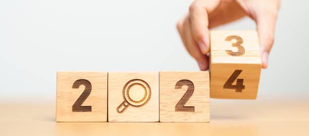 istock 2024 block with magnifying glass icon. SEO, Search Engine Optimization, hiring , Advertising, Idea, Strategy, marketing, Keyword, Content and New Year start concepts 1500766159