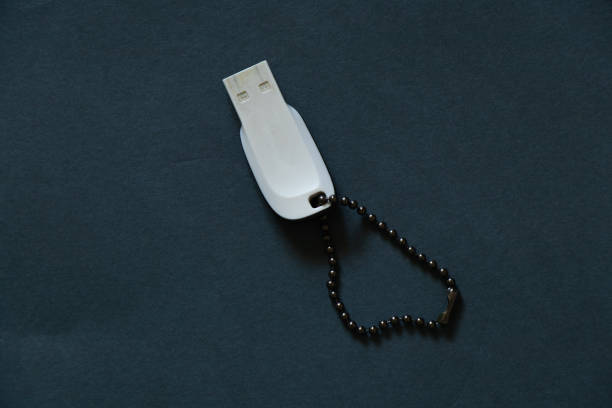 USB drive lies on a dark background
