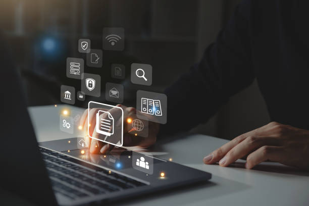istock Businessman working on laptop with document management icon 1500767661