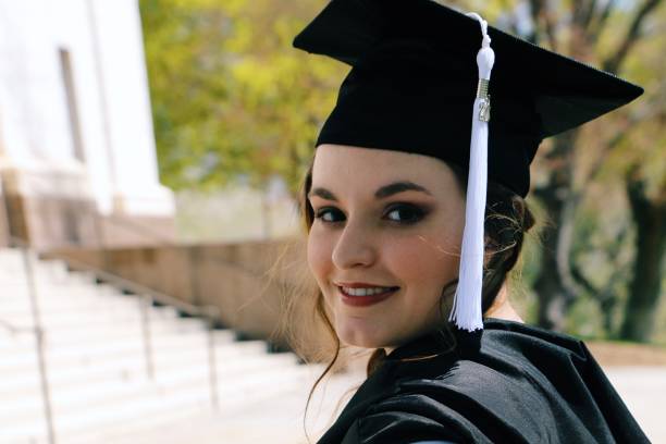 istock Portrait Young Female University Graduate Content Smiling Glancing Over Shoulder Outdoors on Campus Blurred Background Copy Space 1500769199