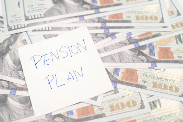 istock Paper note with phrase Pension Plan, dollar banknotes. Retirement concept. Retirement saving and pension planning 1500770451