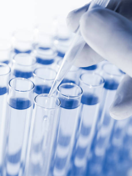 istock Droplet Falling from Pipette into Test Tube. 1500771968