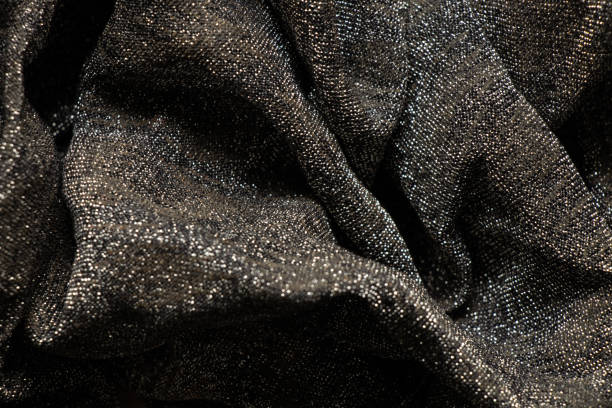 istock black shiny crumpled shawl as background close up 1500773143