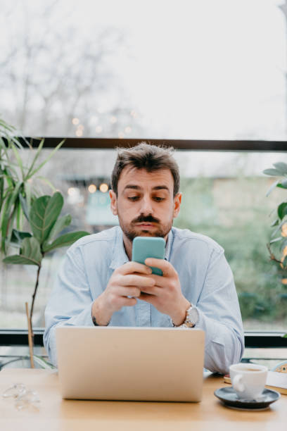 istock A man sitting alone in a restaurant, using his laptop to take an online course or engage in self-improvement activities, highlighting the accessibility of educational resources. 1500774669