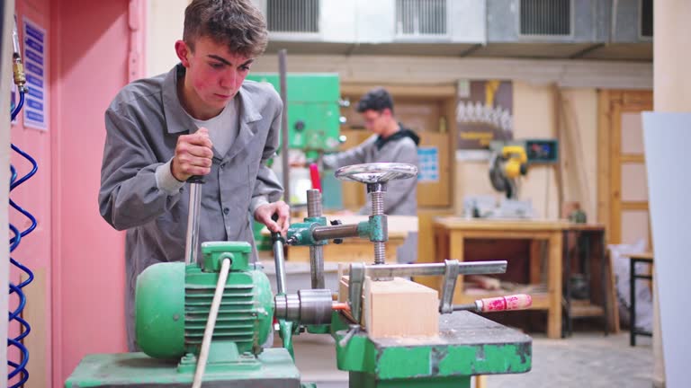 Carpentry Workshop With Students Studying For Apprenticeship At High School