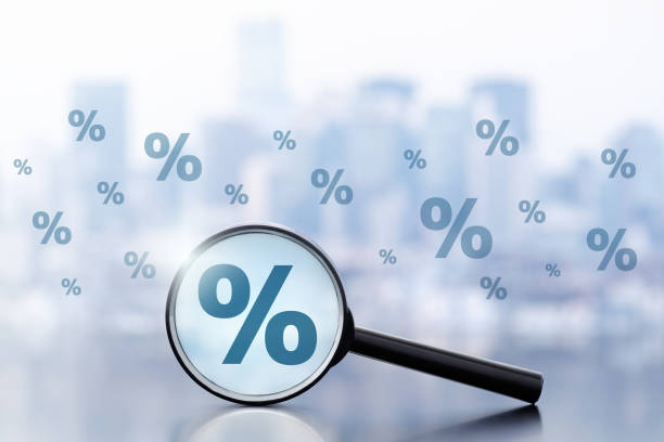 Magnifier and percentage marks on cityscape background.