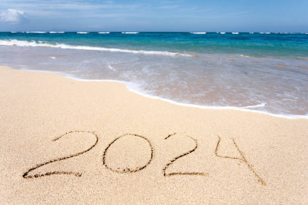 istock New Year 2024, lettering on the beach with wave 1500780662